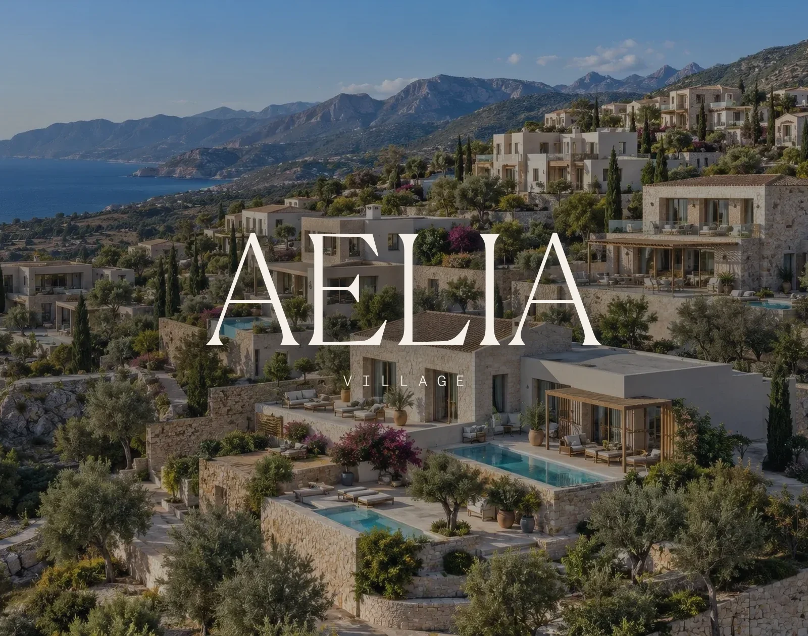 Aelia Village — the wordmark over the hillside above the bay